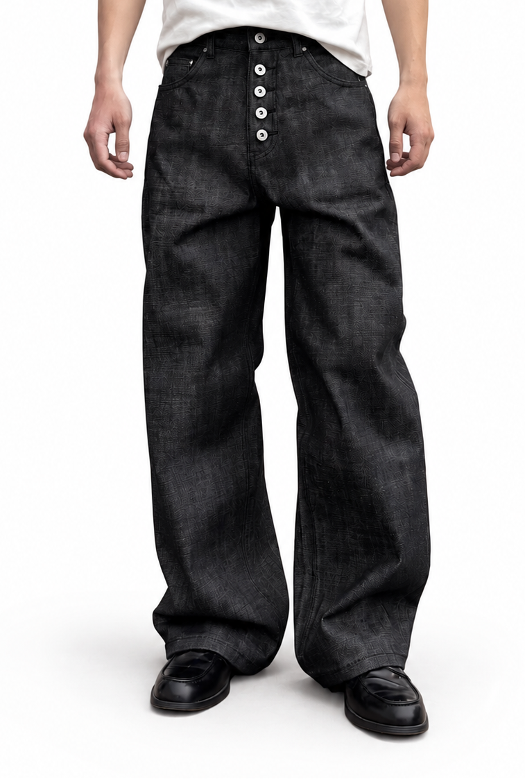 Cinder Indigo Wide — worn on model, wide indigo-black jeans with an exposed button fly over black loafers