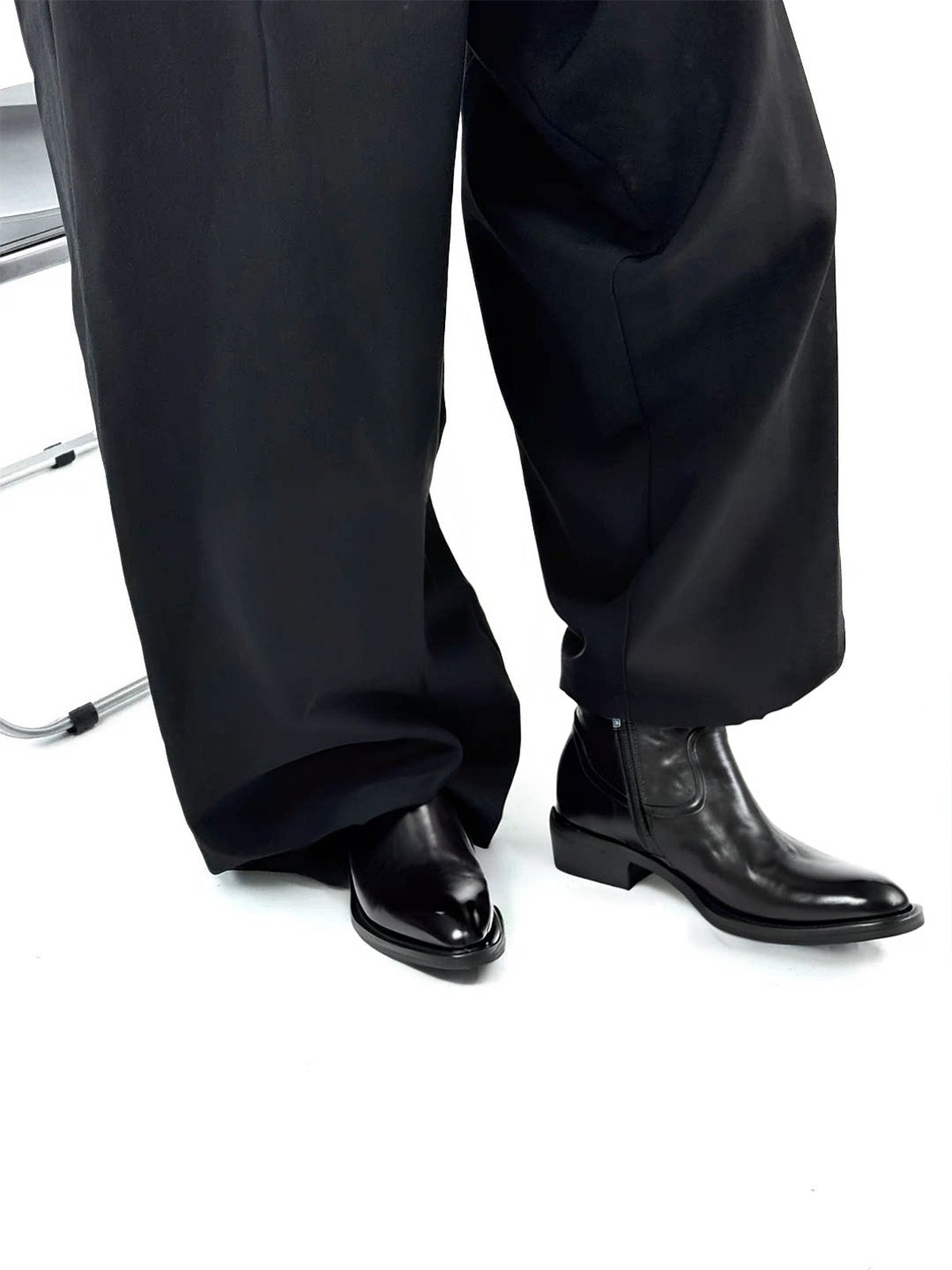 Talus Zip Boot — worn with wide black trousers, standing