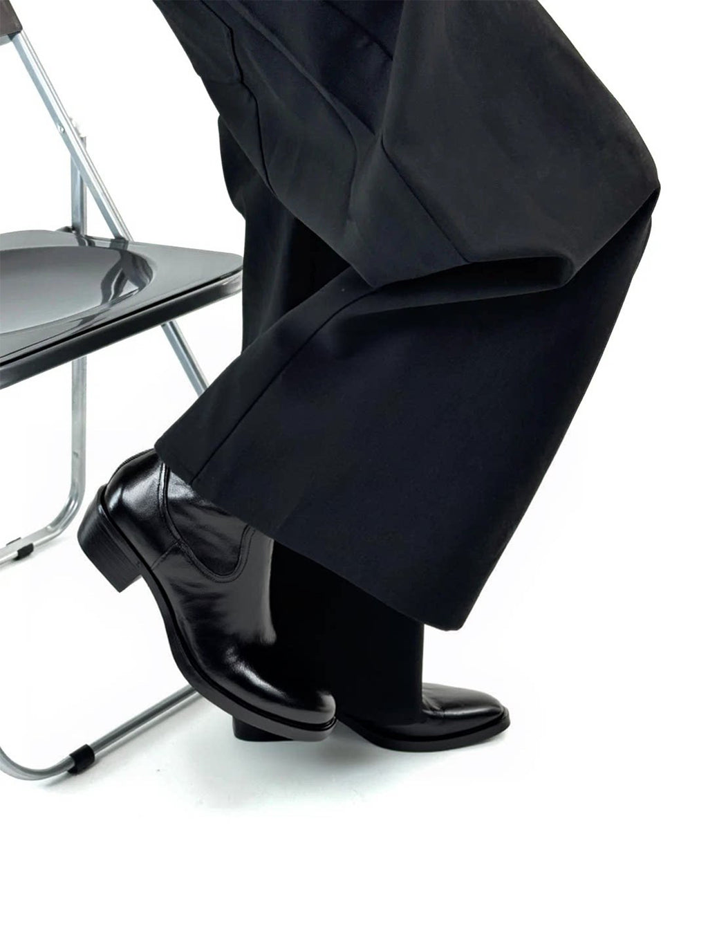 Talus Zip Boot — worn with wide black trousers, side view